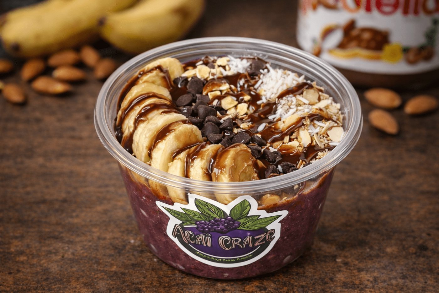Choco-Nut Delight Bowl: açaí with banana slices, chocolate chips, almonds and coconut under a chocolate drizzle