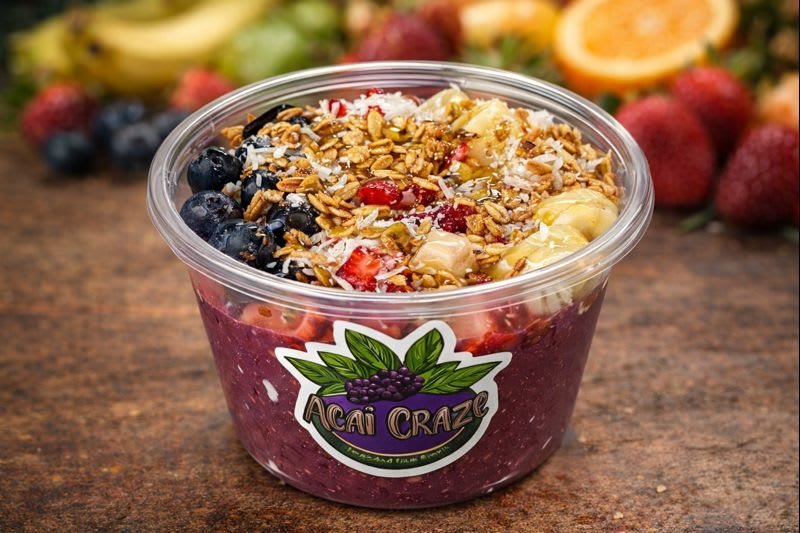Classic Bowl in an Acai Craze cup: açaí topped with granola, blueberries, strawberries, banana and coconut shavings