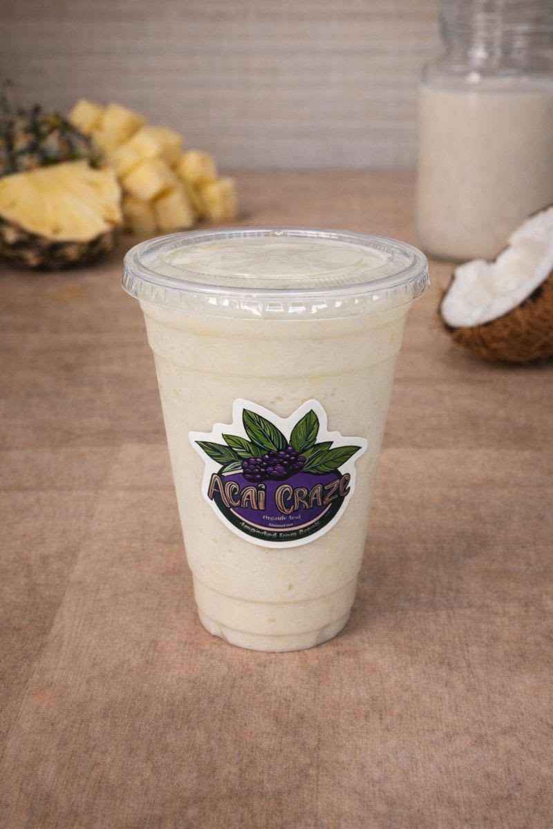 Creamy white Piña Colada smoothie in a branded Acai Craze cup