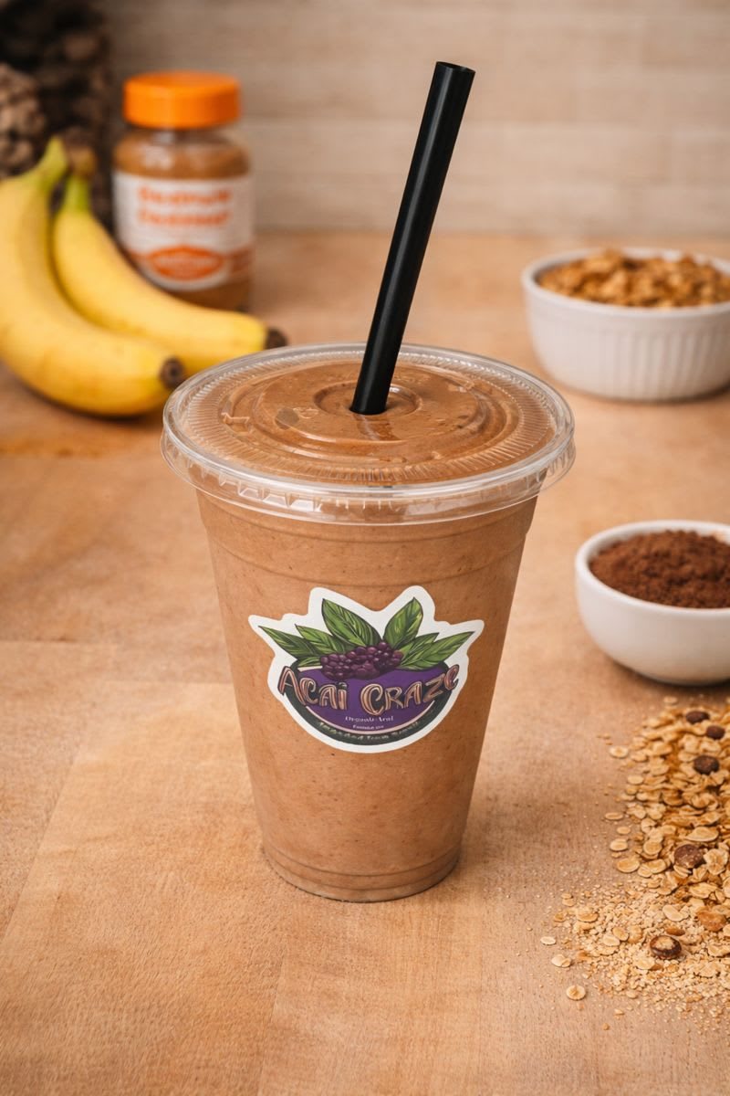 Protein Paradise smoothie in a branded Acai Craze cup with a black straw