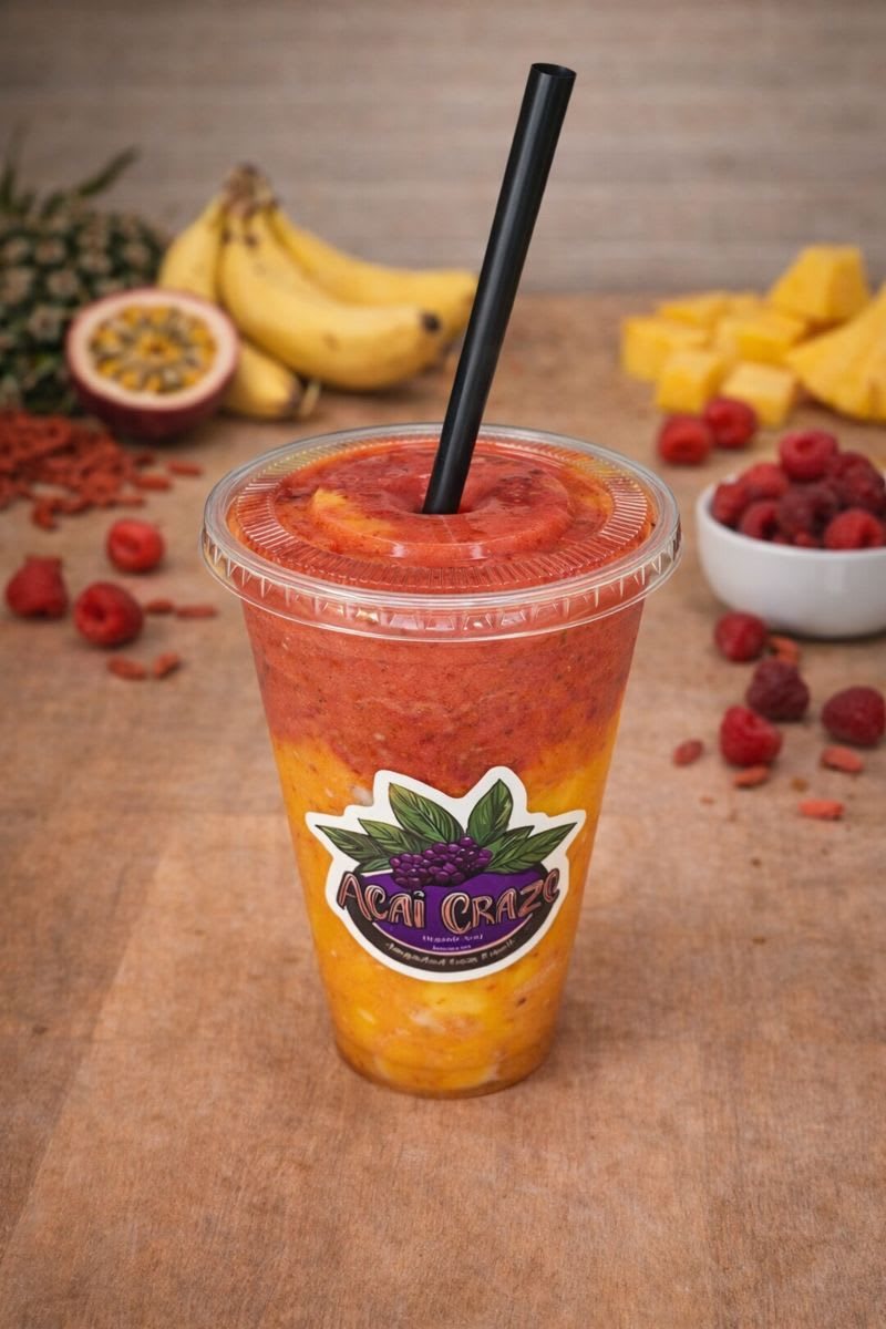 Tropical Refreshment smoothie, layered orange and red, in a branded Acai Craze cup